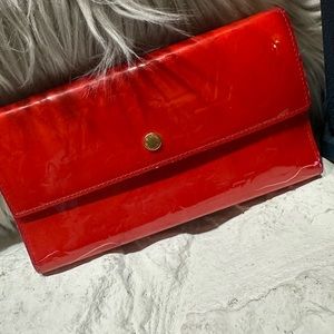 Authentic red orange Louis Vuitton  wallet.